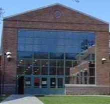 brick building with glass and blue sky