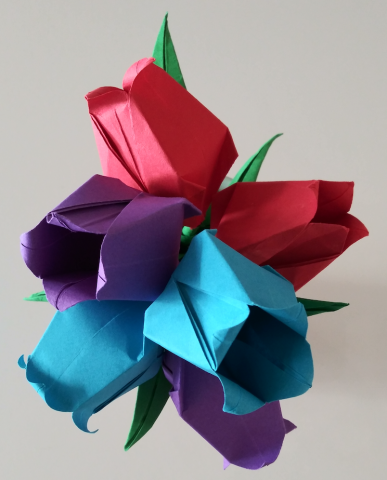 Example of the completed origami project with two tulips in each of these lucky colors: red, purple, and blue.