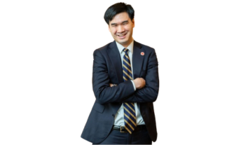 Portrait of David T. Imamura, a young Asian American legislator with short black hair, wearing a dark suit, tie, and light shirt.