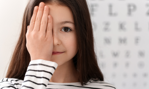 Person in front of an eye chart