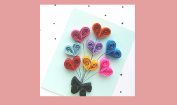 light blue card with quilled hearts on pink background