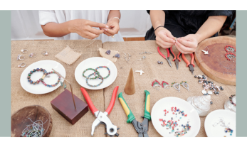 people making jewelry on green background